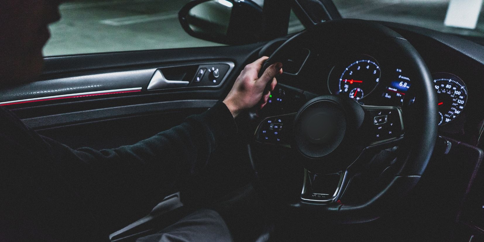 Driver’s hands on a steering wheel