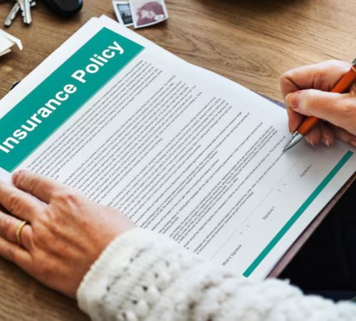 Person signing an insurance policy document